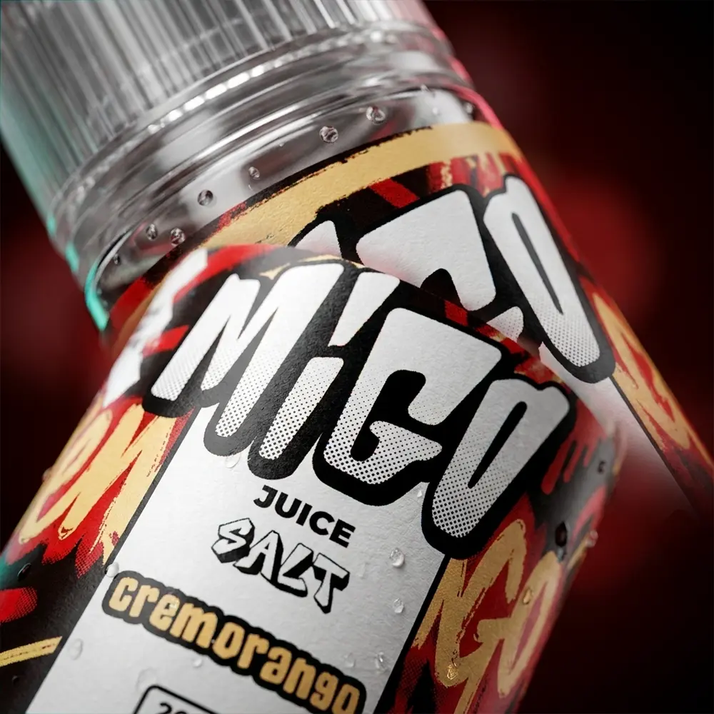 Close-up do rótulo e bico do Líquido Migo Salt Cremorango com gotas de condensação e textura do rótulo visível - Vapor Gringo