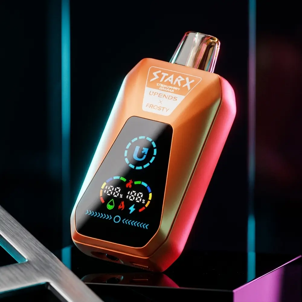 Pod descartavel StarX Frosty Strawberry Banana em close angular sobre base acrilica espelhada com luzes frias - Vapor Gringo