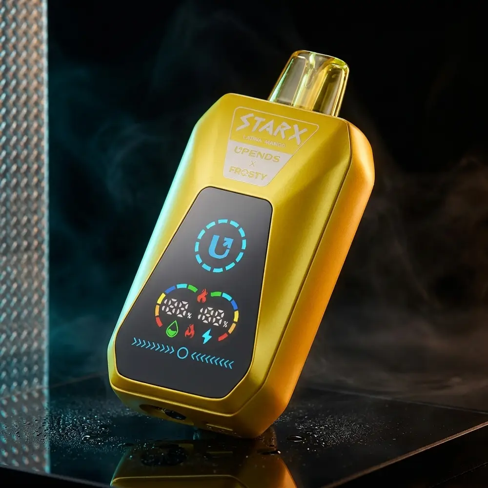 Pod Descartável StarX Frosty Latina Mango em close dramático sobre acrílico preto com reflexos cian e âmbar - Vapor Gringo