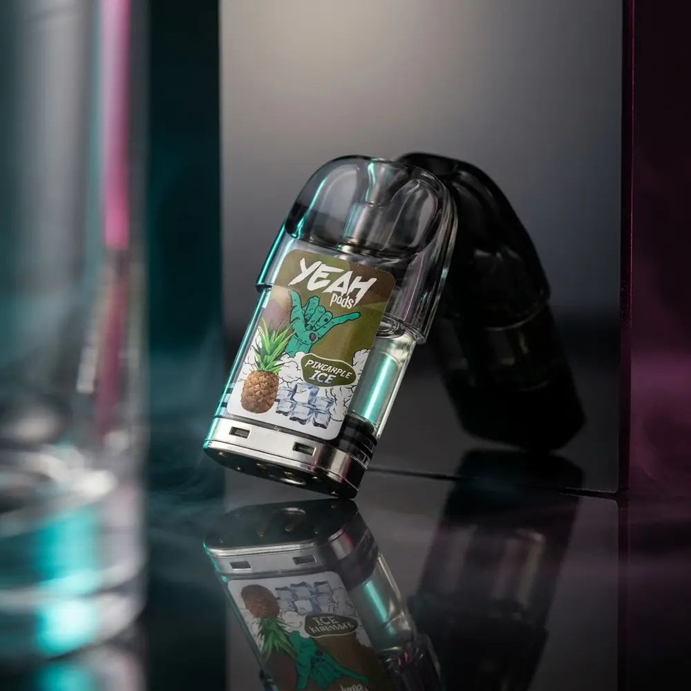 Refil para Pod Yeah Pineapple ICE sobre acrilico preto, iluminação teal e magenta e reflexo realista - Vapor Gringo