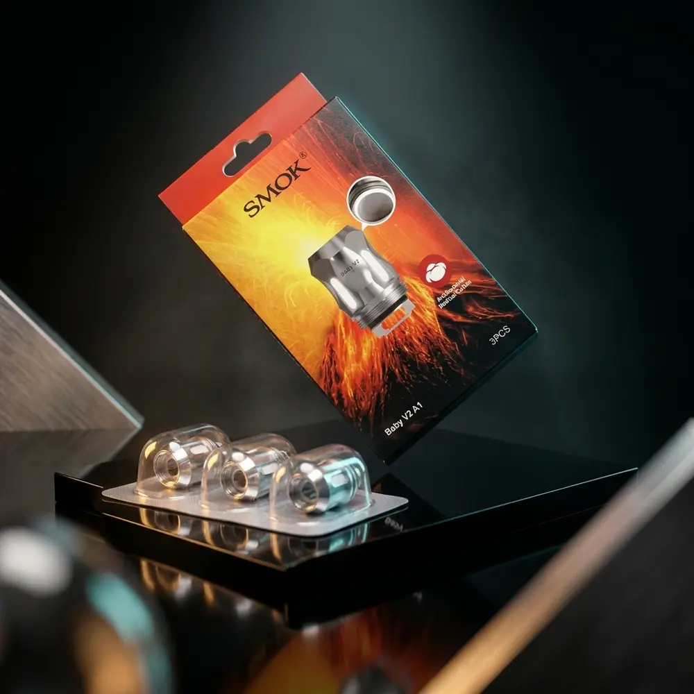 Resistência Coil TFV8 BABY V2 A1 Smok sobre acrílico preto com luzes âmbar e ciano, embalagem em destaque - Vapor Gringo