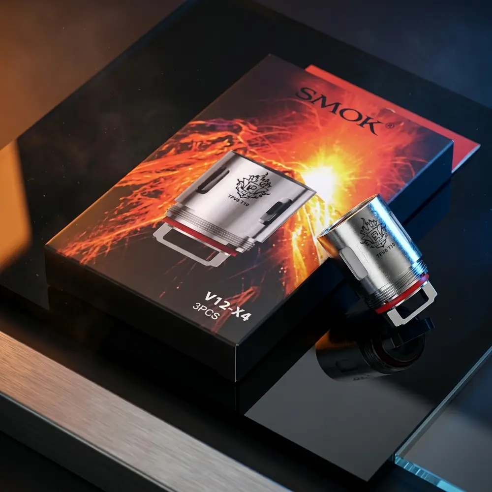 Resistencia Coil TFV8 T10 Smok sobre acrilico preto com reflexos azuis e laranja e a embalagem visivel - Vapor Gringo