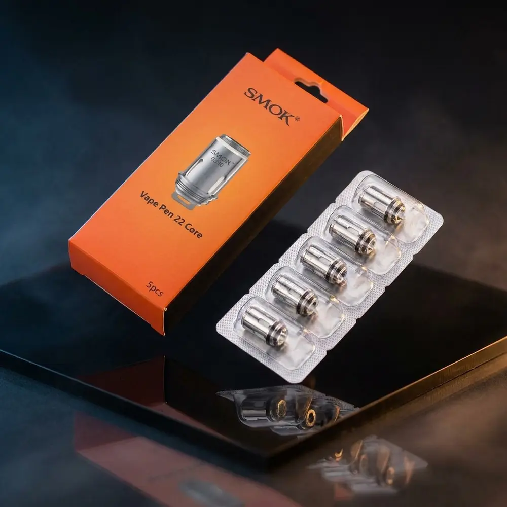 Resistência Coil Vape Pen 22 e Pen V2 da Smok em close sobre base acrílica escura, reflexos frios - Vapor Gringo