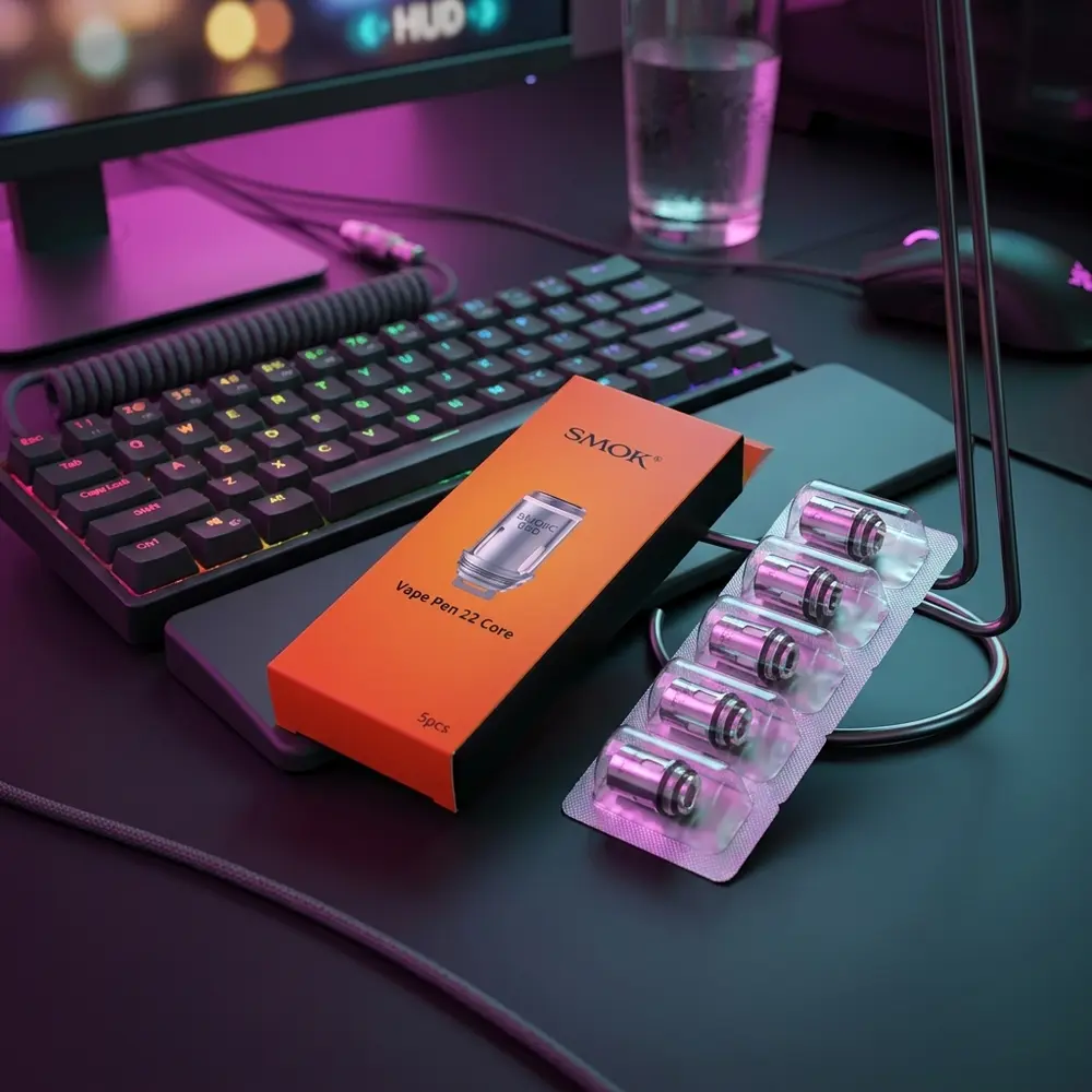 Resistência Coil Vape Pen 22 e Pen V2 da Smok apoiada em mesa gamer RGB com reflexos de luzes coloridas - Vapor Gringo