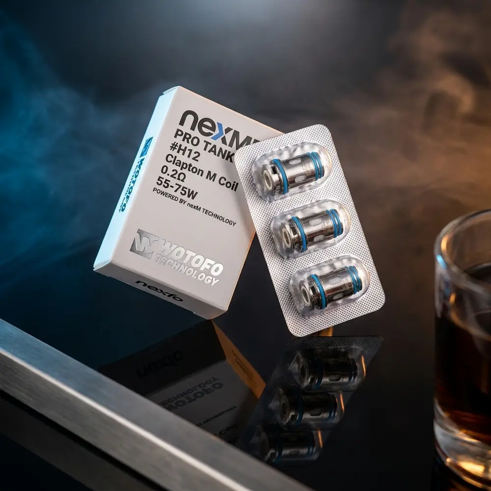 Resistência NexMesh Pro Tank 0.2ohm Wotofo sobre acrílico preto com luzes dramáticas e reflexos - Vapor Gringo