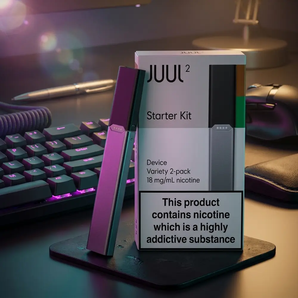 Starter Kit Juul 2 gunmetal em mesa gamer RGB ao lado de teclado retroiluminado e coaster metalico - Vapor Gringo